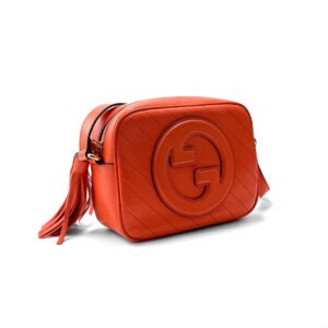 Borsa Soho Disco di Gucci in pelle arancione con finiture dorate e nappina in pelle.