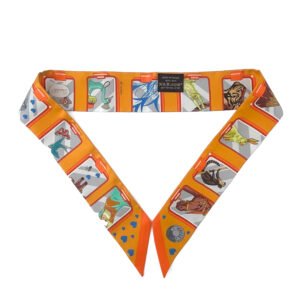 Vibrant Hermès Story Twilly Scarf in multicolor orange showcasing iconic Hermès symbols.